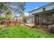 This home features a backyard with a screened porch, picnic table, and wooden garden boxes for outdoor enjoyment at 200 Lincoln Ct, Raleigh, NC 27610