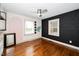Bedroom with hardwood floors, ceiling fan and creative wall decor at 200 Lincoln Ct, Raleigh, NC 27610