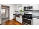 Well-equipped kitchen featuring stainless steel appliances and modern fixtures, creating a functional space at 200 Lincoln Ct, Raleigh, NC 27610