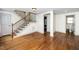 Inviting living area featuring hardwood floors and staircase, perfect for relaxing and entertaining guests at 200 Lincoln Ct, Raleigh, NC 27610