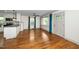 Bright living room with hardwood floors, large windows, and a view of the kitchen, great for gatherings at 200 Lincoln Ct, Raleigh, NC 27610