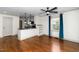 Open-concept living room with hardwood floors, and a view of the modern kitchen, creating a cozy atmosphere at 200 Lincoln Ct, Raleigh, NC 27610