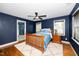Bedroom boasts hardwood floors, ceiling fan, and ensuite bathroom at 200 Lincoln Ct, Raleigh, NC 27610