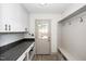 Convenient mud room with storage cabinets, a bench, and direct access to outdoors at 200 Lincoln Ct, Raleigh, NC 27610