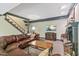 Basement Gathering room area with a leather sofa, fireplace and TV, perfect for gatherings at 2004 Riverview Dr, Clayton, NC 27527