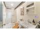 Cozy bathroom with a shower, toilet, and vanity with a decorative mirror and vintage decor at 2004 Riverview Dr, Clayton, NC 27527