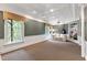 Large bonus room features a unique ceiling, large windows, and built-in shelving at 2004 Riverview Dr, Clayton, NC 27527