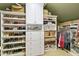 Organized walk-in closet with custom shelving and drawers for ample storage of clothing and accessories at 2004 Riverview Dr, Clayton, NC 27527