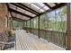 Large wood deck with multiple benches and a view of the woods at 2004 Riverview Dr, Clayton, NC 27527