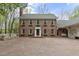 Charming brick home with classic architecture and beautiful flower boxes under the windows at 2004 Riverview Dr, Clayton, NC 27527