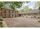 Spacious brick home featuring a long driveway and a multi-car garage at 2004 Riverview Dr, Clayton, NC 27527