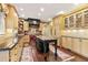 Traditional kitchen featuring custom cabinets, island with marble countertop, and stainless appliances at 2004 Riverview Dr, Clayton, NC 27527