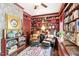 Cozy library featuring custom bookshelves and comfortable seating with a window seat at 2004 Riverview Dr, Clayton, NC 27527