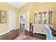 Bright office space with built-in display cabinet and easy access to an adjacent kitchen at 2004 Riverview Dr, Clayton, NC 27527