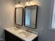 Bathroom with a double sink vanity and modern mirrors at 207 Sallinger St, Knightdale, NC 27545