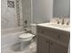 Bathroom featuring a modern vanity, stylish fixtures, and a sleek tub with marble-look surround at 207 Sallinger St, Knightdale, NC 27545