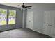 This bedroom features neutral paint, carpet, a ceiling fan and double-door closet for ample storage at 207 Sallinger St, Knightdale, NC 27545
