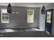 Dining room with decorative trim, modern chandelier, and wood-look flooring at 207 Sallinger St, Knightdale, NC 27545