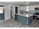 Kitchen with granite countertops, stainless steel appliances, and a center island at 207 Sallinger St, Knightdale, NC 27545