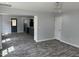 Spacious living room with elegant lighting, decorative trim and wood-look flooring at 207 Sallinger St, Knightdale, NC 27545