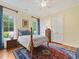 Traditional style bedroom featuring a decorative rug, ceiling fan, and ample natural light at 21 Kimberly Dr, Durham, NC 27707