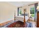 Bedroom showcases a bright interior with hardwood floors, bedside tables, and light-filled windows at 21 Kimberly Dr, Durham, NC 27707