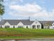 Beautiful clubhouse boasting well-manicured lawn, with elegant architecture, and a serene setting at 21 Kimberly Dr, Durham, NC 27707