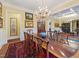 Dining room featuring a chandelier, hardwood floors, and elegant decor at 21 Kimberly Dr, Durham, NC 27707