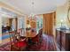 Formal dining room with a large table, chandelier, and elegant furnishings at 21 Kimberly Dr, Durham, NC 27707