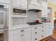 Modern kitchen featuring stainless steel appliances and marble countertops at 21 Kimberly Dr, Durham, NC 27707