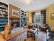 Inviting living room with a brick fireplace, built-in bookshelves, and comfortable seating at 21 Kimberly Dr, Durham, NC 27707