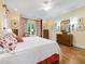 Main bedroom with hardwood floors, bright yellow walls and large windows for natural lighting at 21 Kimberly Dr, Durham, NC 27707