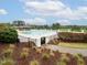 Community pool featuring lounge area, large pool deck, manicured landscaping, and a fenced perimeter at 21 Kimberly Dr, Durham, NC 27707