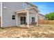 Backyard featuring an outdoor covered patio area perfect for relaxing at 211 Tobacco Barn Dr, Angier, NC 27501