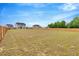 Expansive backyard enclosed by a wooden fence, offering ample space and privacy for outdoor activities at 211 Tobacco Barn Dr, Angier, NC 27501