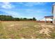 Spacious backyard, enclosed by a wooden fence, providing ample space for outdoor activities at 211 Tobacco Barn Dr, Angier, NC 27501
