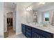 Modern bathroom with double sinks, a large mirror, and sleek vanity cabinet at 211 Tobacco Barn Dr, Angier, NC 27501