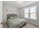 Bedroom featuring carpet floors, a bed, and a window with light-blocking blinds at 211 Tobacco Barn Dr, Angier, NC 27501