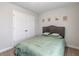 Cozy bedroom featuring carpet, a comfortable bed and a closet with panelled doors at 211 Tobacco Barn Dr, Angier, NC 27501