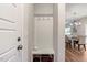 Mud room space with coat hooks, a shelf, and access to the dining area at 211 Tobacco Barn Dr, Angier, NC 27501