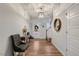 Bright and open entryway with hardwood floors and stylish decor, creating a welcoming atmosphere at 211 Tobacco Barn Dr, Angier, NC 27501