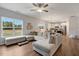 Spacious living room with natural light, a comfortable sectional sofa, and an open layout to the kitchen at 211 Tobacco Barn Dr, Angier, NC 27501