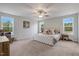 Spacious Primary bedroom with a large windows allowing plenty of natural light and carpeted floors at 211 Tobacco Barn Dr, Angier, NC 27501