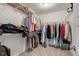 Walk-in closet with shelving and hanging racks for optimal organization at 211 Tobacco Barn Dr, Angier, NC 27501
