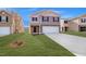 Charming two-story home with a spacious two-car garage and well-maintained lawn at 2149 Monk Dr, Haw River, NC 27258