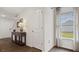 Welcoming entryway with wood floors, console table, and view of staircase at 2149 Monk Dr, Haw River, NC 27258