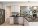 Open kitchen showcasing stainless steel appliances, granite counters and an eat-in island at 215 Kipling Creek Dr, Fuquay Varina, NC 27526