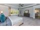 Bright primary bedroom with a large window, tray ceiling, ceiling fan, and a well-appointed dresser at 215 Kipling Creek Dr, Fuquay Varina, NC 27526