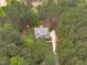 Aerial view of a home nestled among trees at 2408 Merion Creek Dr, Apex, NC 27539