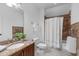 Charming bathroom with granite countertop, vanity, tiled shower-tub, and modern fixtures at 2408 Merion Creek Dr, Apex, NC 27539